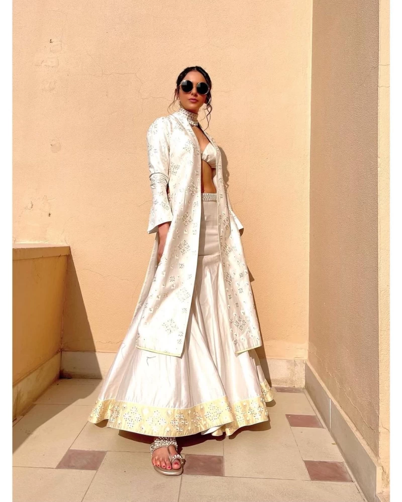 Rakul Preet Singh cuts a statusque figure in the white lehenga with a matching jacket