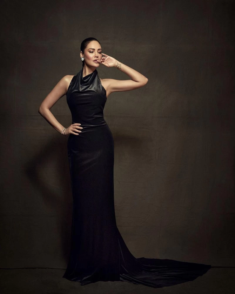 Esha Gupta cuts a statusque figure in the black halterneck dress