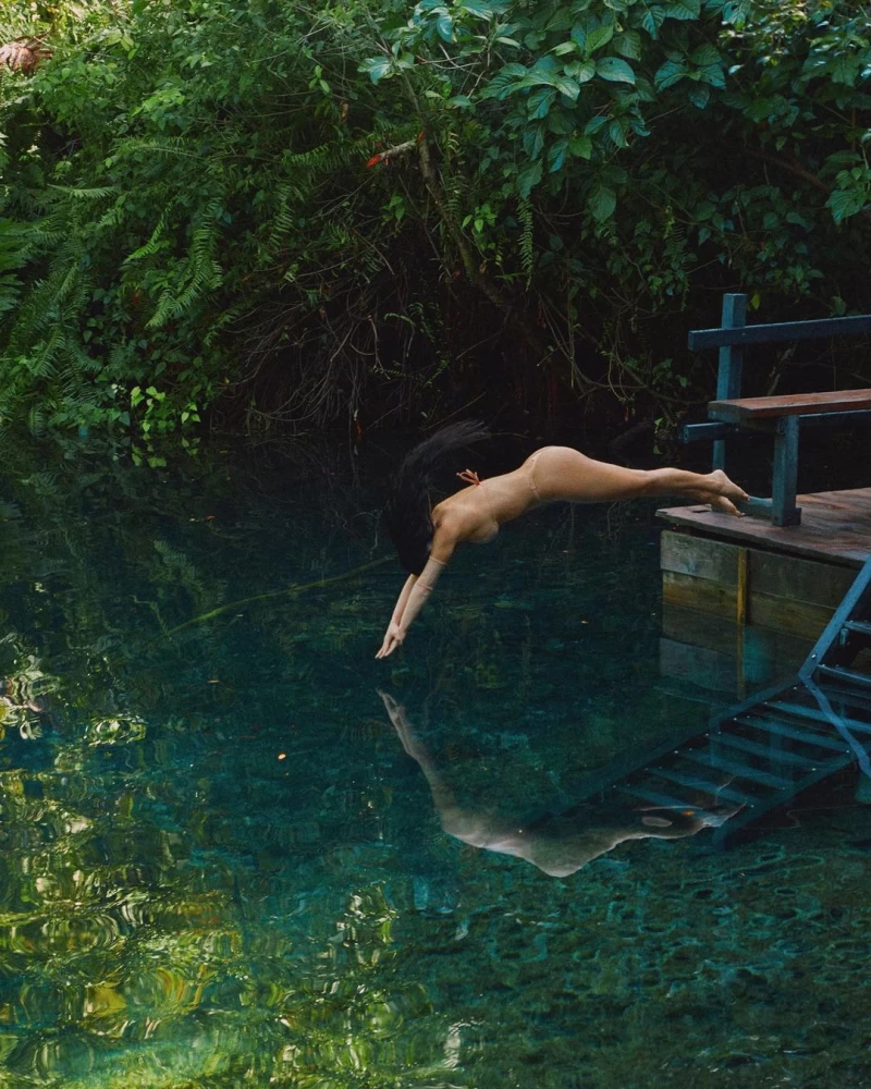 Kim Kardashian looks sexy as she takes a dip in the pool