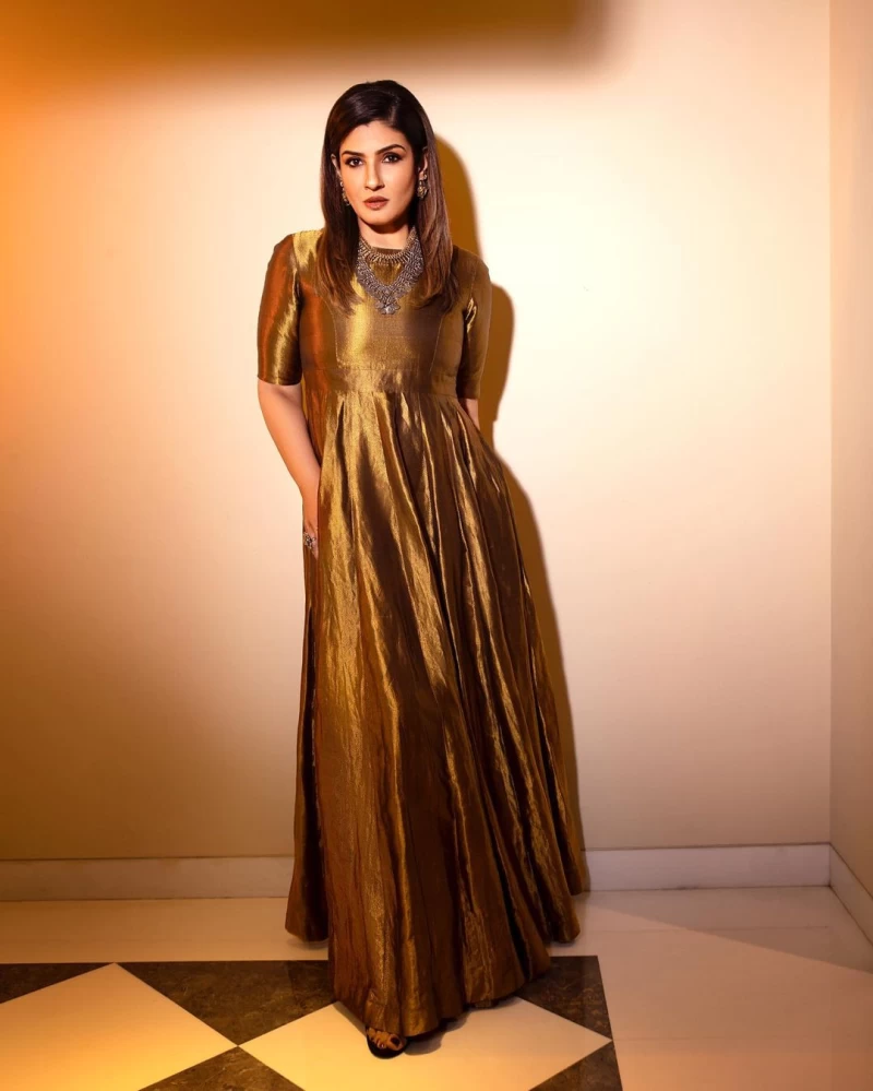Raveena Tandon cuts a striking figure in the golden maxi dress
