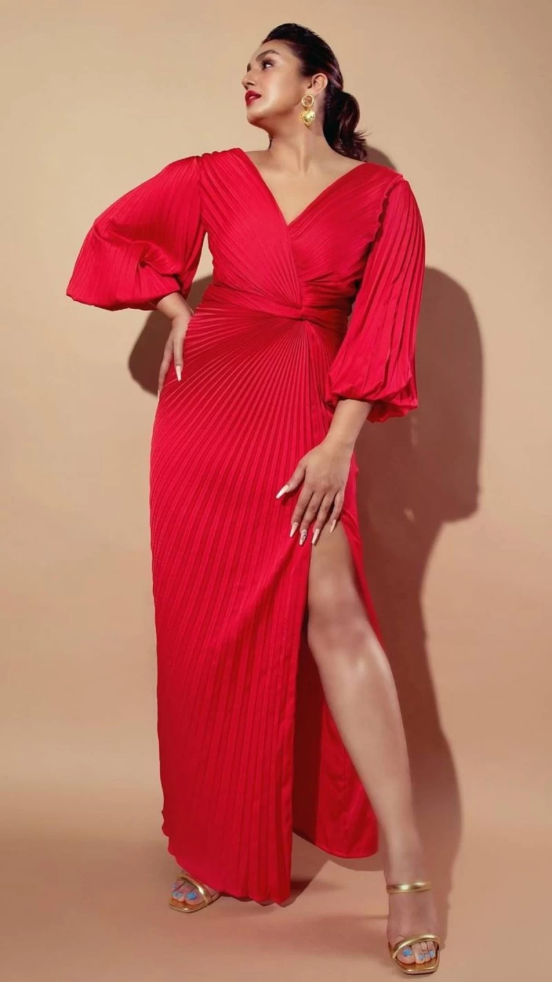 Huma Qureshi is raising temperatures in a red pleated dress.
