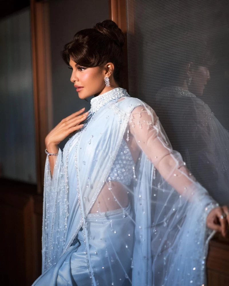 Jacqueline Fernandez looks pristine in the pastel blue pearl-encrusted saree