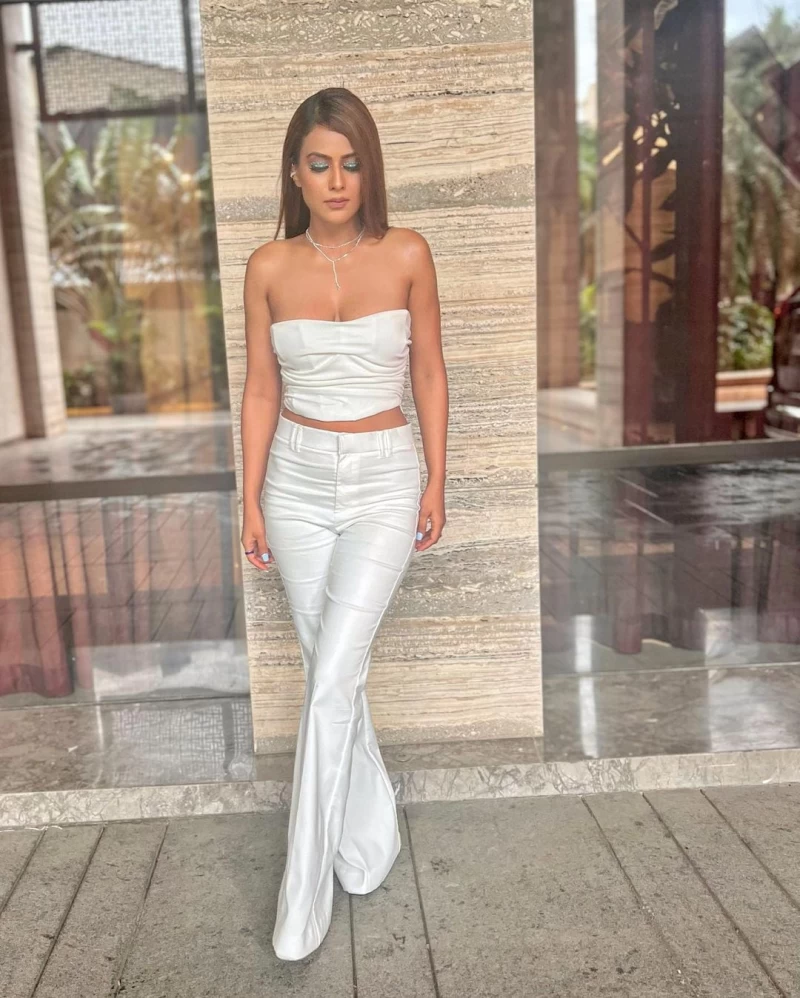 Nia Sharma looks chic and sexy in the white crop top and matching pants