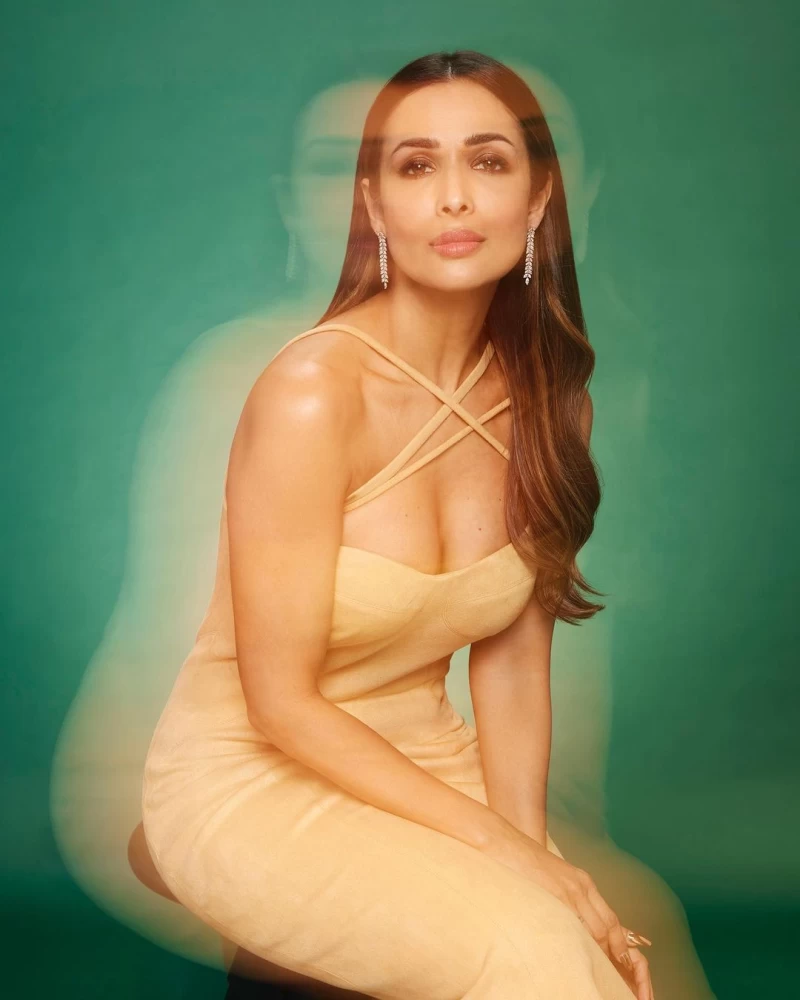 Malaika Arora looks stunning in a cleavage-baring yellow dress in her latest photoshoot.