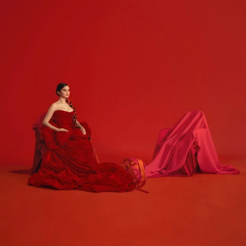 Sharing this oh-so-classy picture in a long red gown - Selena Gomez