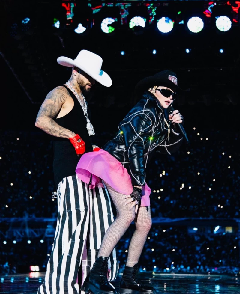 Sporting a pink frock with a broad black belt, Madonna was seen performing at a concert in Medellin, Colombia.