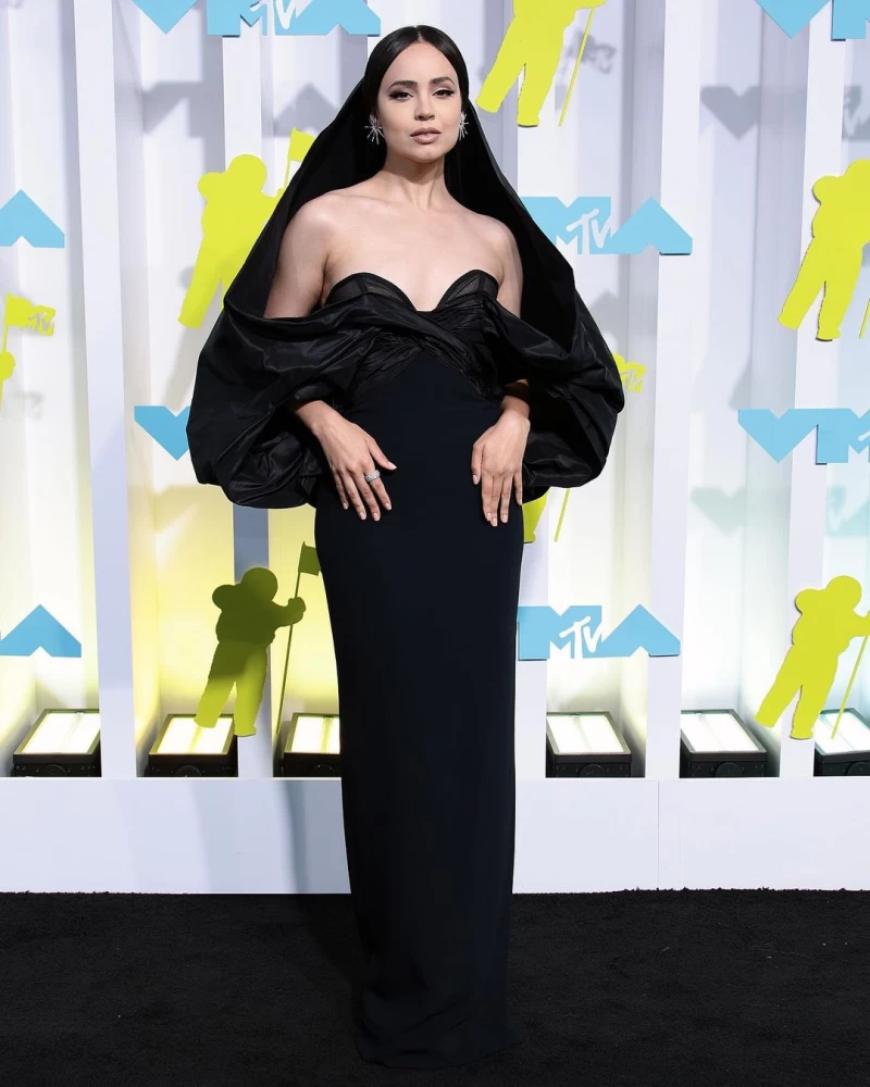 Sofia Carson looked regal in the black dress with a matching headgear.