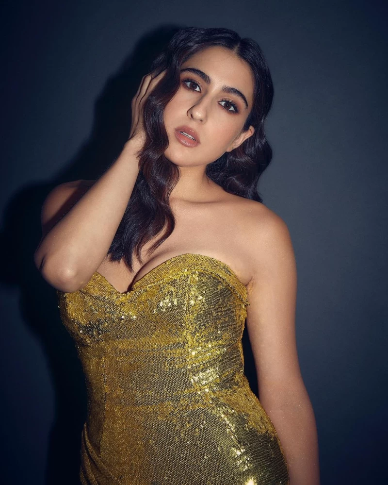 Sara Ali Khan looks sizzling in the golden dress with a sweetheart neckline