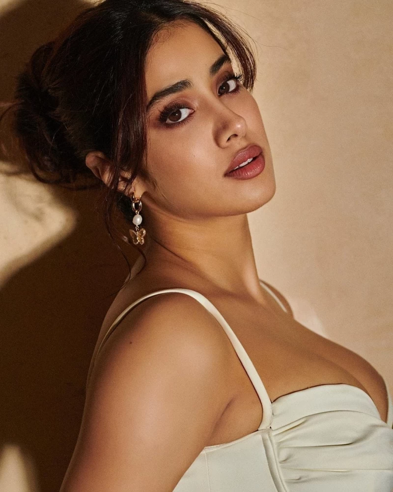 Janhvi Kapoor accessorises the look with a pair of dainty butterfly earrings