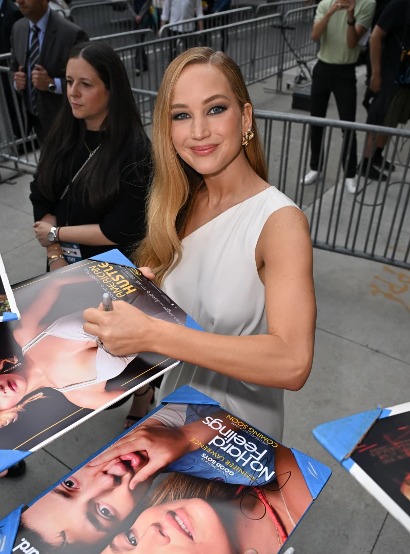 Jennifer Lawrence signs autographs outside the premiere of 