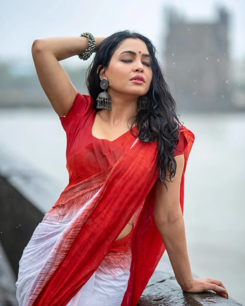 Shubhangi Atre, Indian TV actress, wearing red and white sari, Saranya Chaudhary.