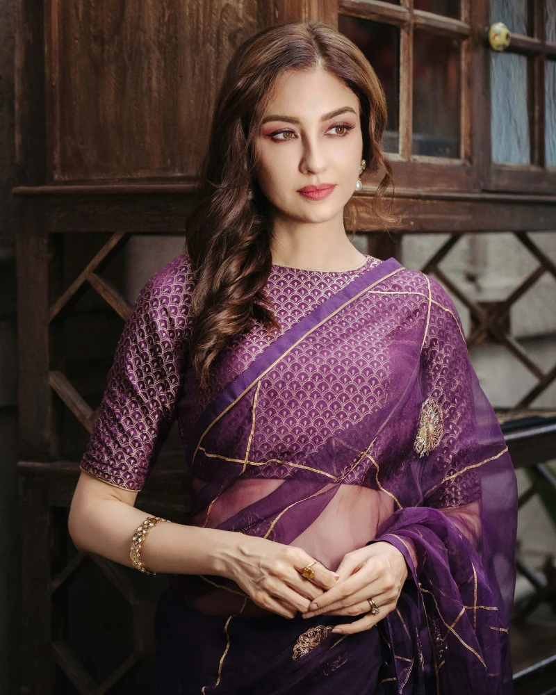 The vibrant hues of tradition come alive as Saumya Tandon showcases the allure of a purple sari