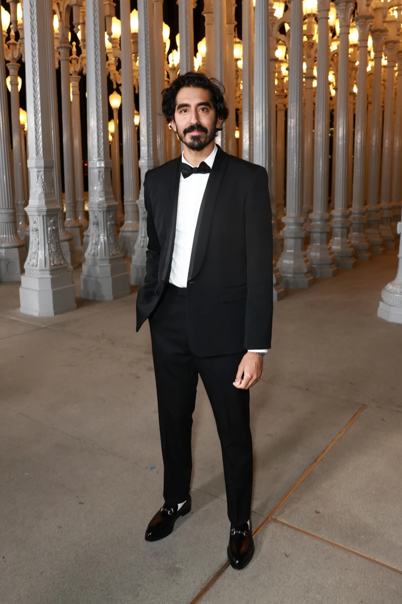 Dev Patel, wearing Gucci