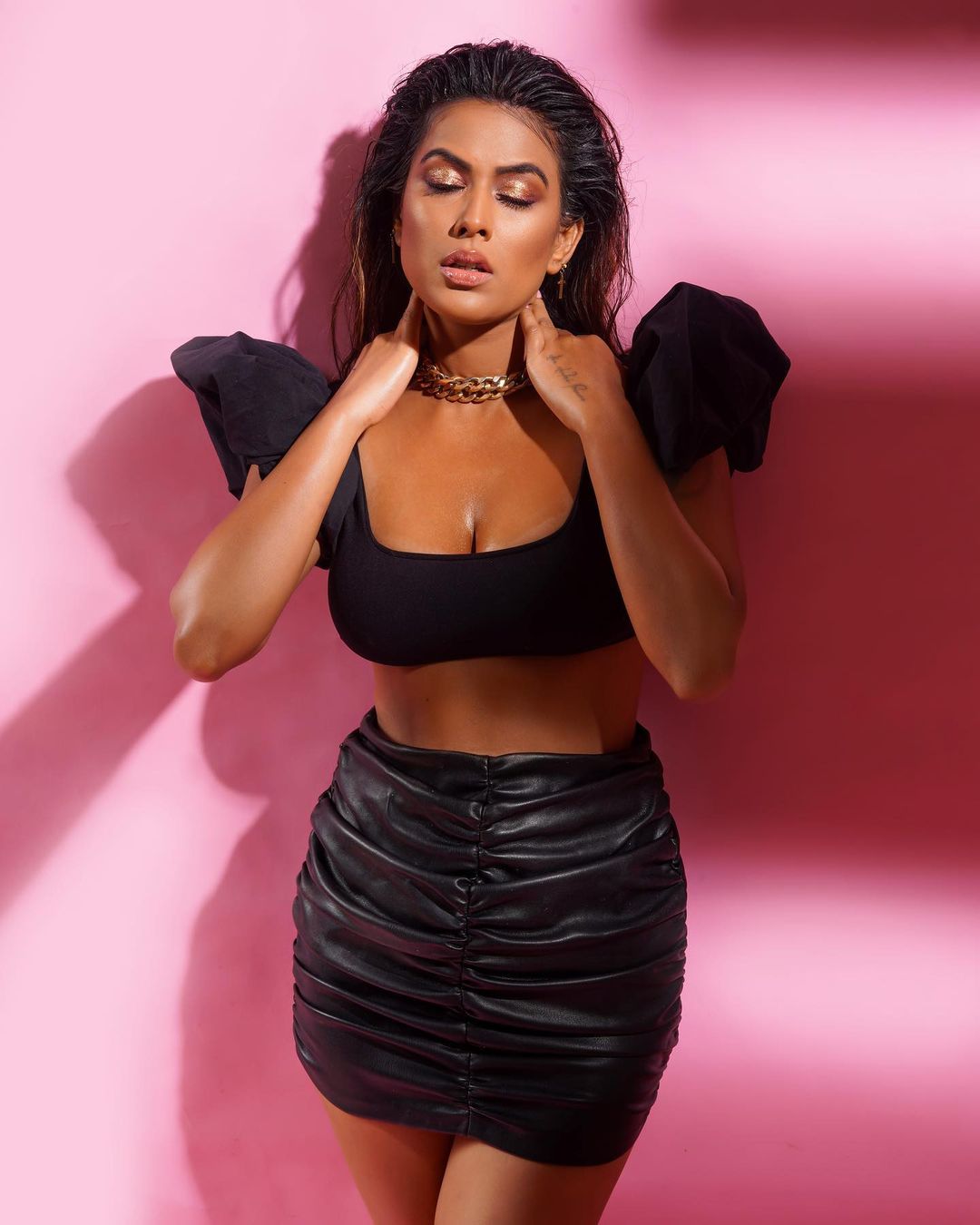 Nia Sharma looks scorching as ever in a black crop top and ruched faux leather skirt