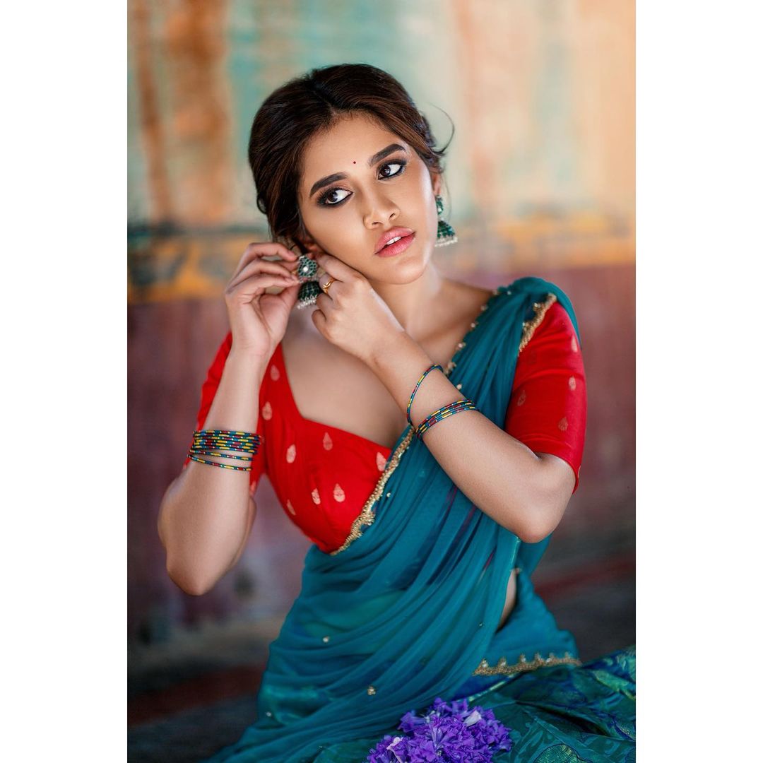 Nabha Natesh Sizzles In Red And Blue Half Saree!
