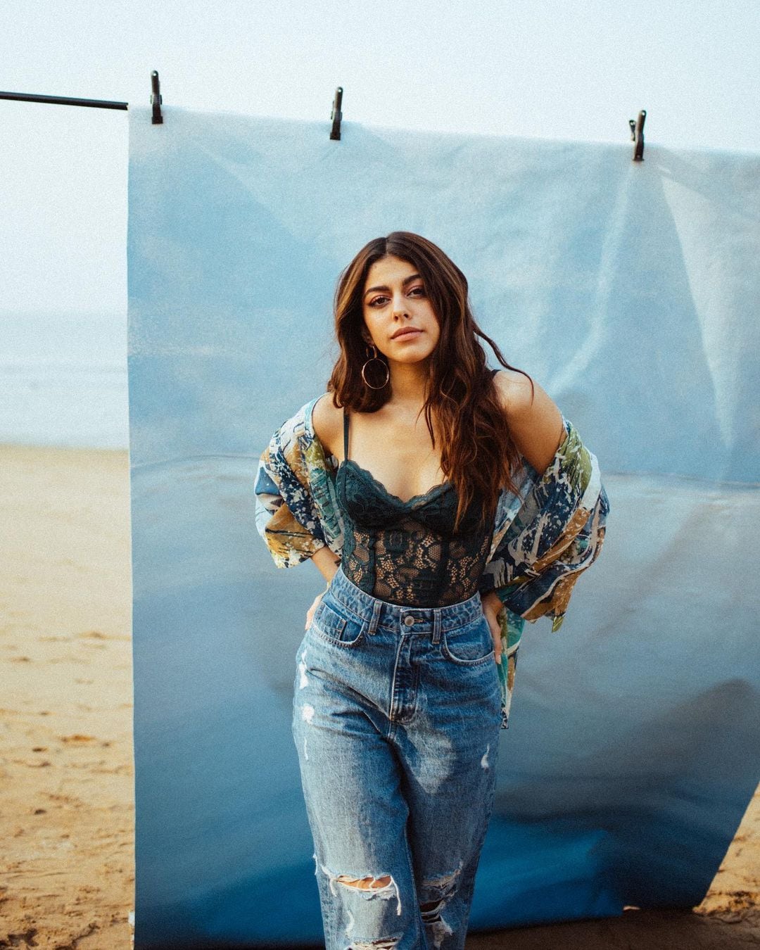 Alaya F looks smart in the lace top, ripped denims and printed shirt