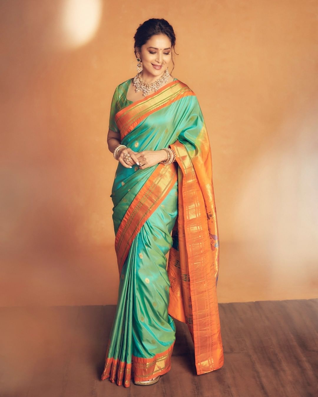 Madhuri Dixit looks gorgeous in the traditional silk saree