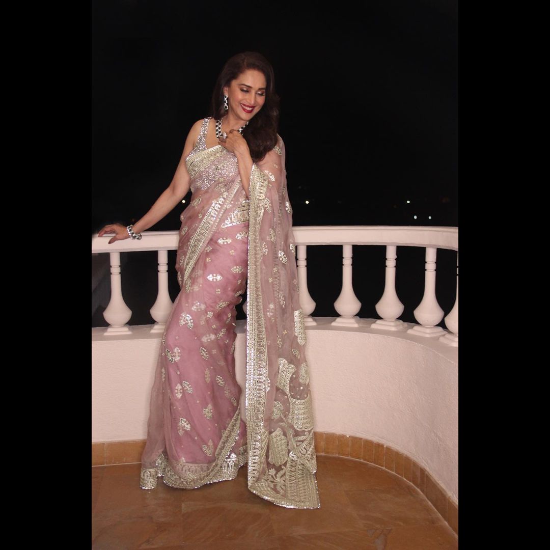 Madhuri Dixit looks lovely in the pastel pink saree