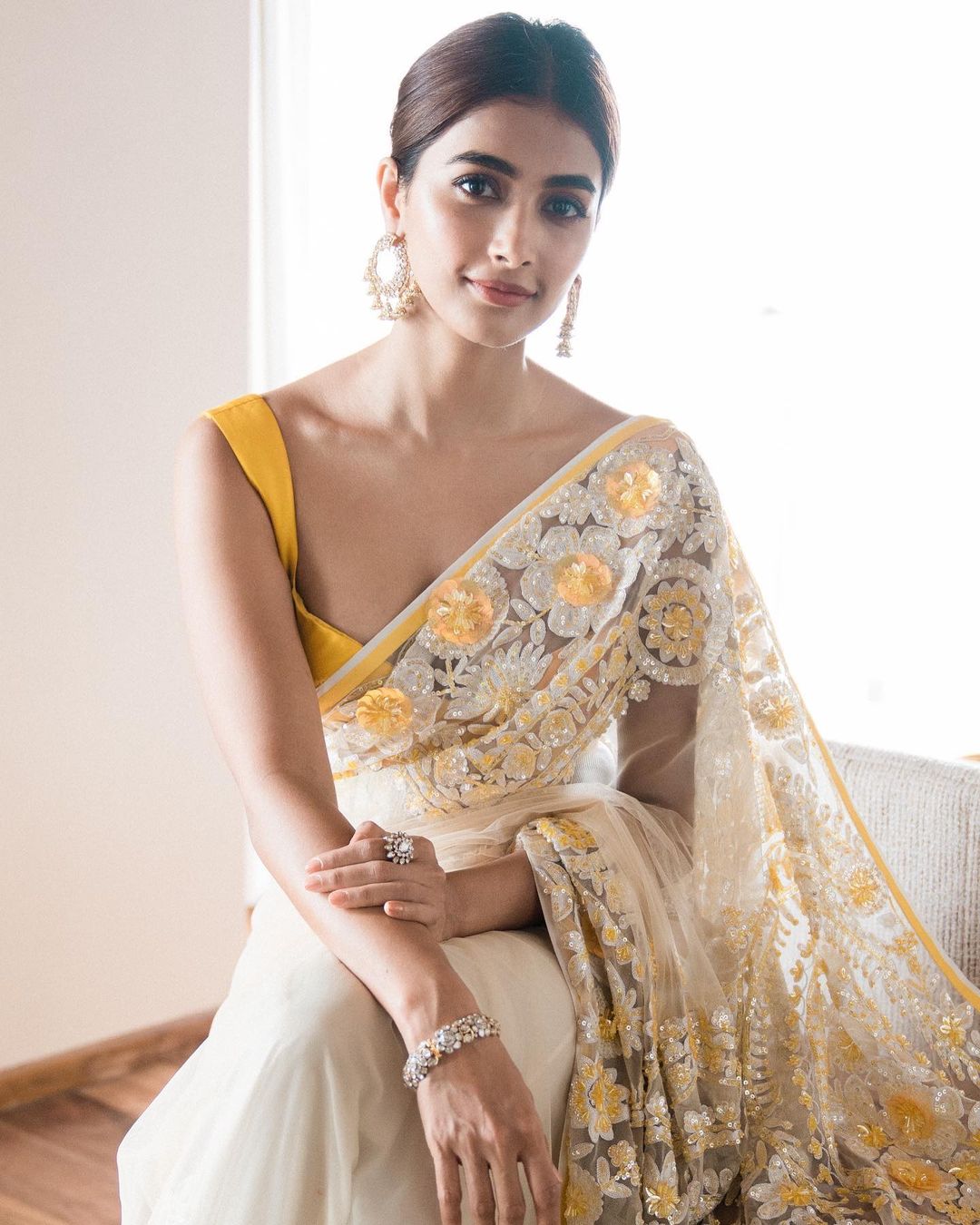 Pooja Hegde looks pretty in the floral embellished saree