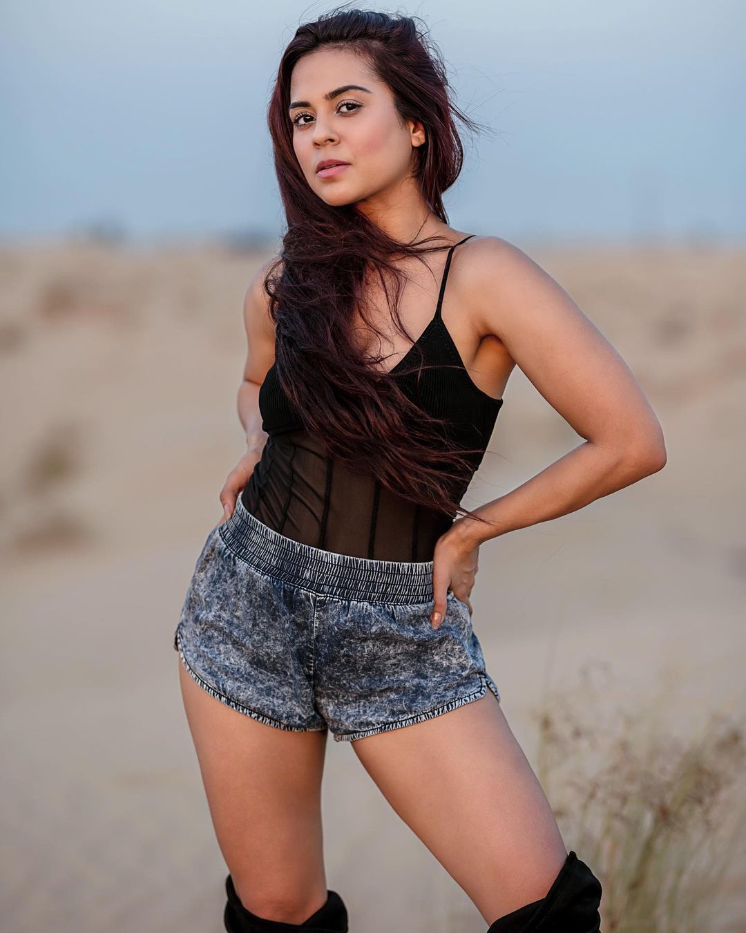 Sana Saeed rocks it in the black spagetti-strap top and denim shorts.