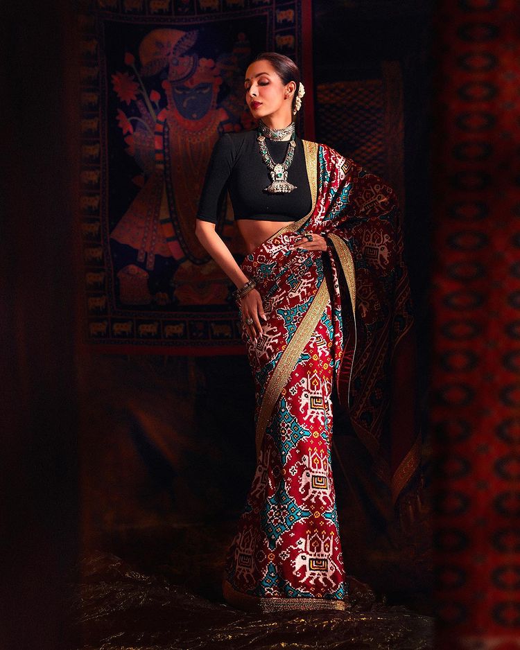 Malaika Arora looks majestic in the printed saree with the black blouse