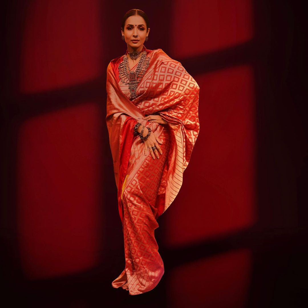 Malaika Arora looks traditional in the red and golden saree
