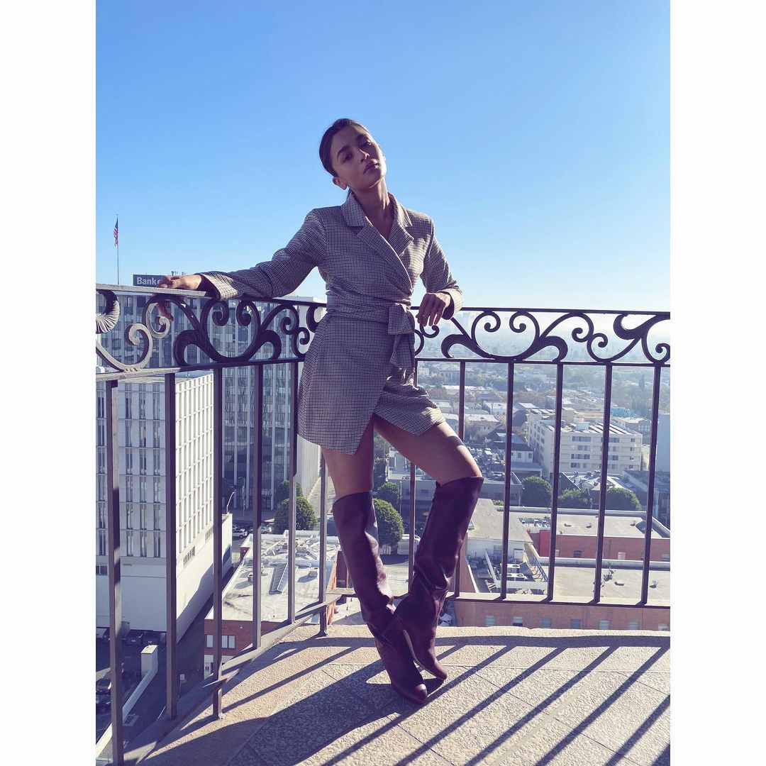 Alia Bhatt pairs her belted blazer dress with knee-high boots