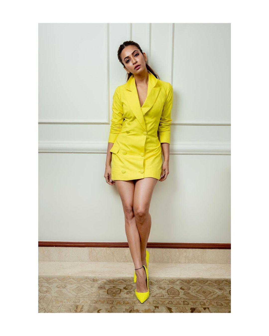 Kriti Kharbanda keeps it fashionable in the yellow blazer dress with matching shoes.
