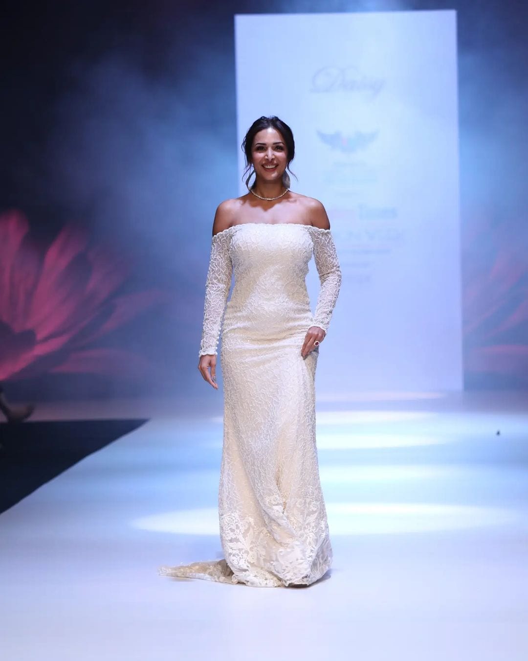 Malaika Arora looks exquisite as she walks the ramp in a white gown