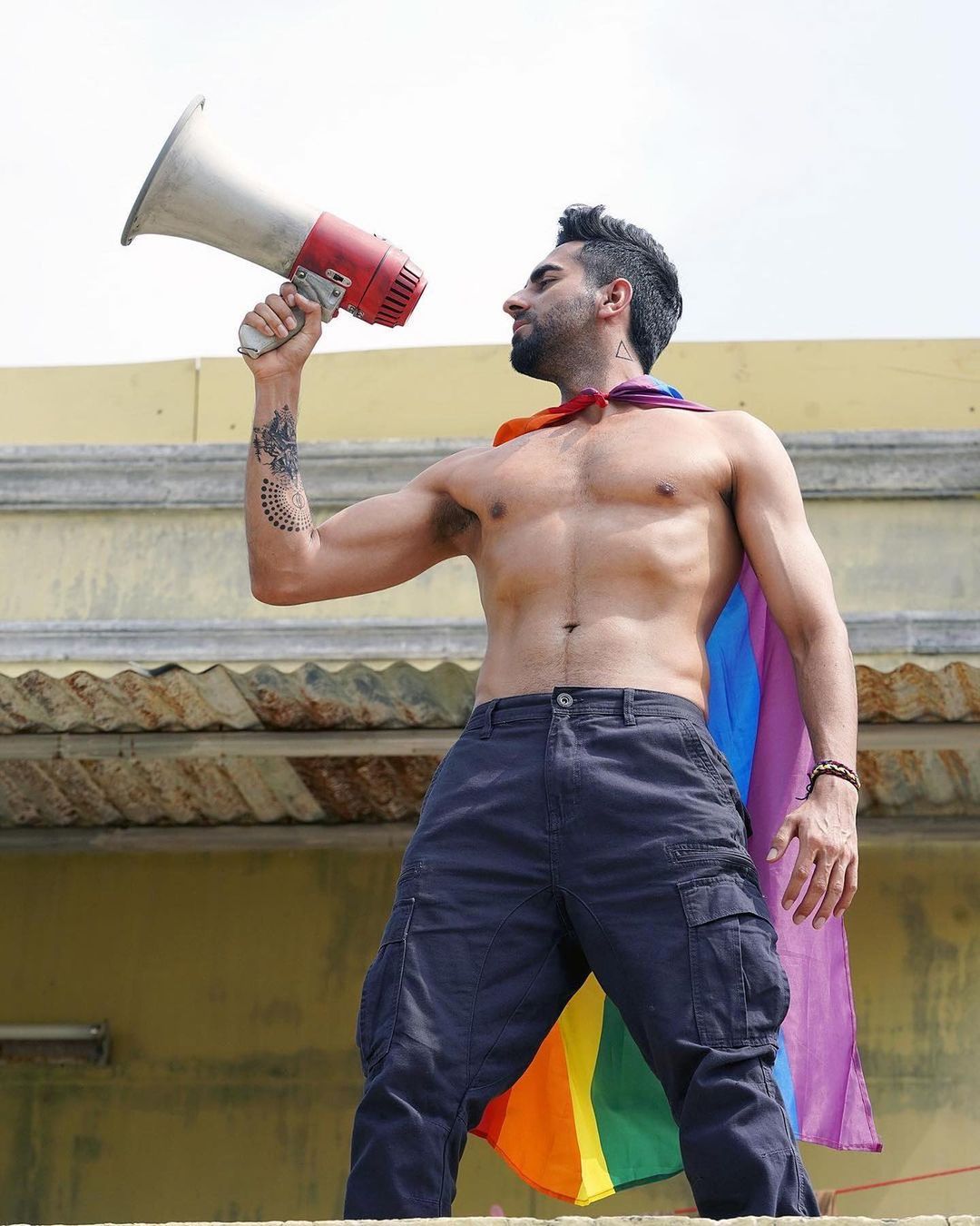 Ayushmann Khurrana looks sexy, wearing just his trousers and the Pride flag