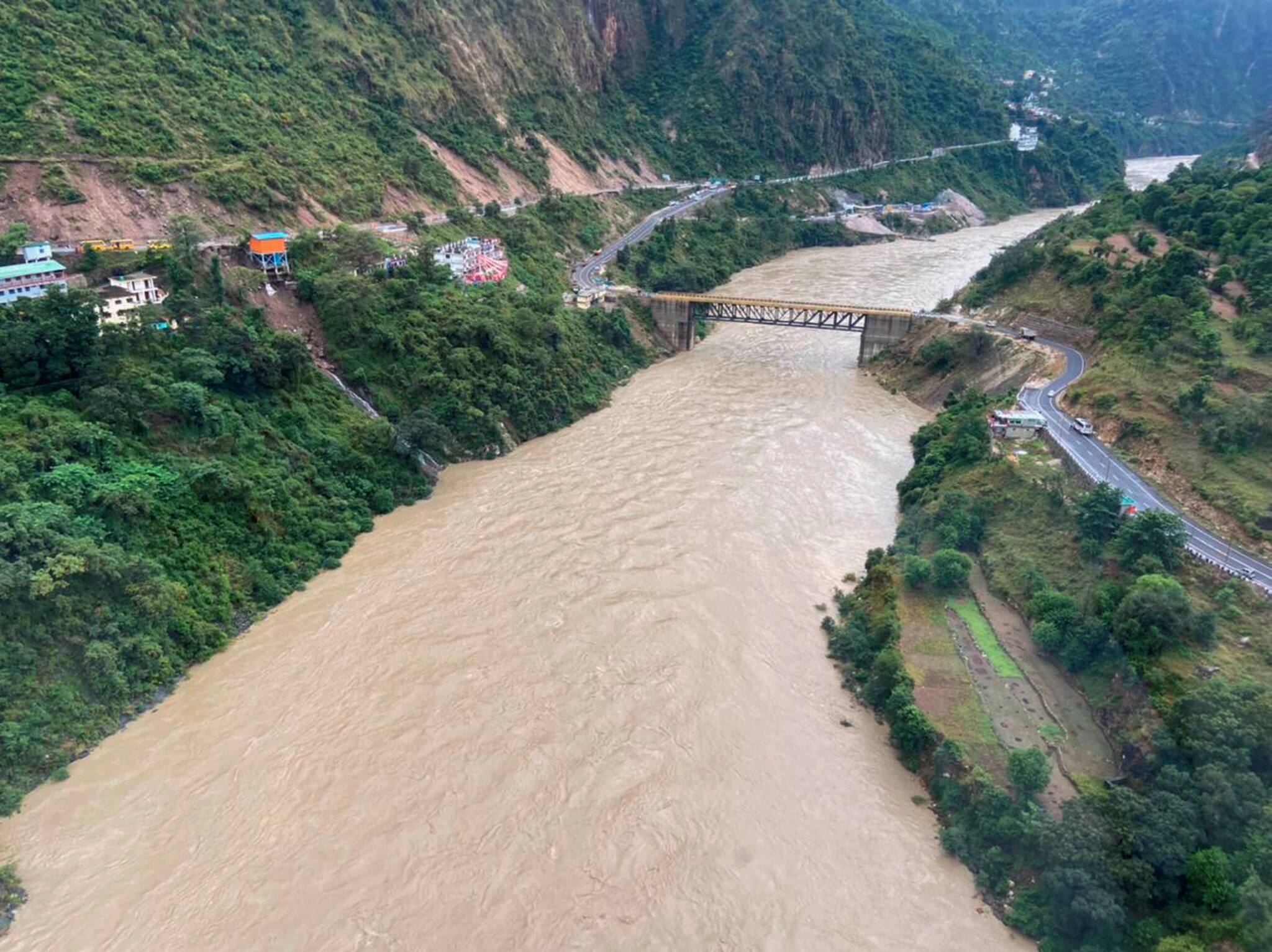 Dehradun: A view of a swollen river after heavy rain.
