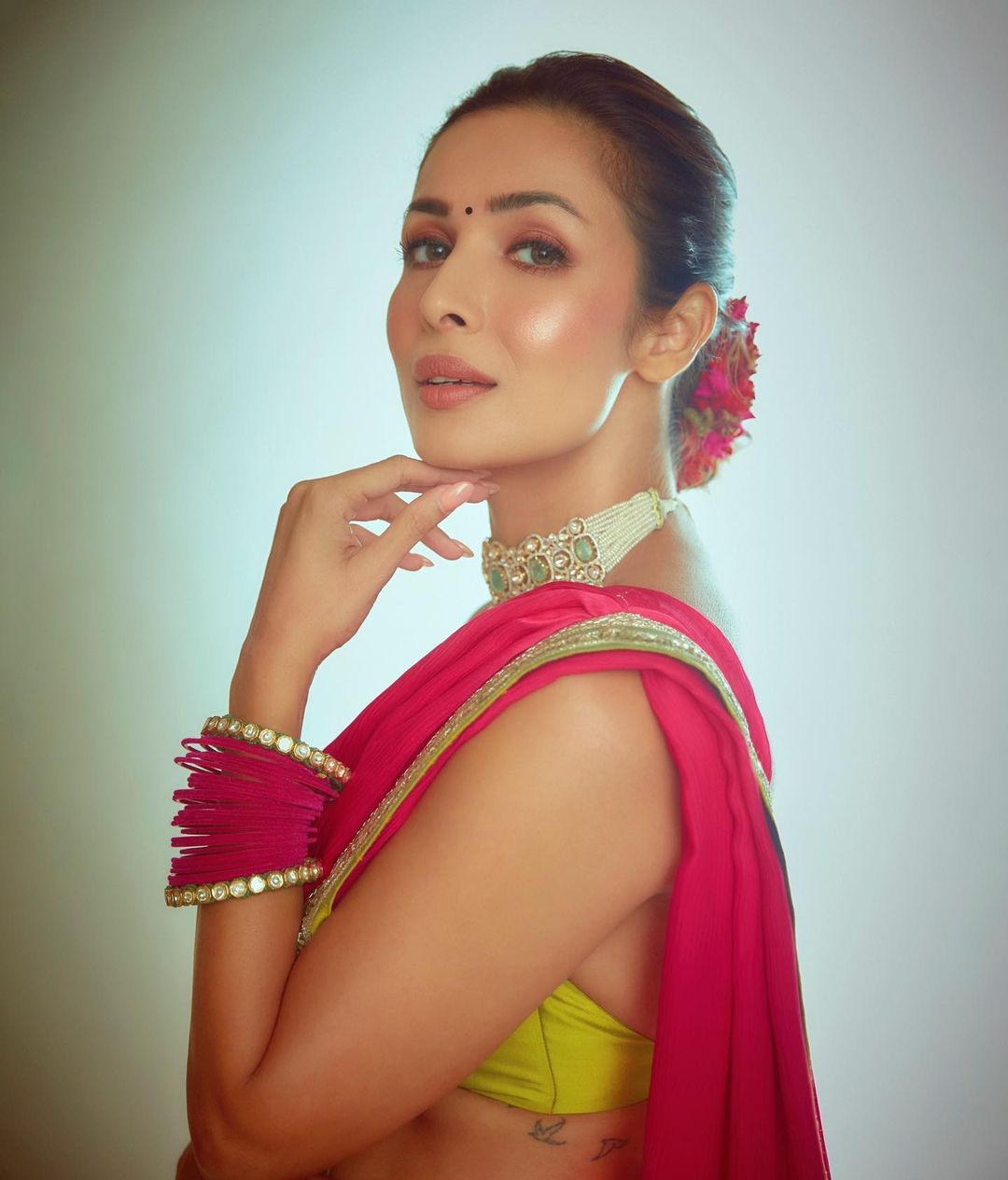 Malaika Arora accessorises her ethnic look with a diamond choker and pink bangles on just one wrist