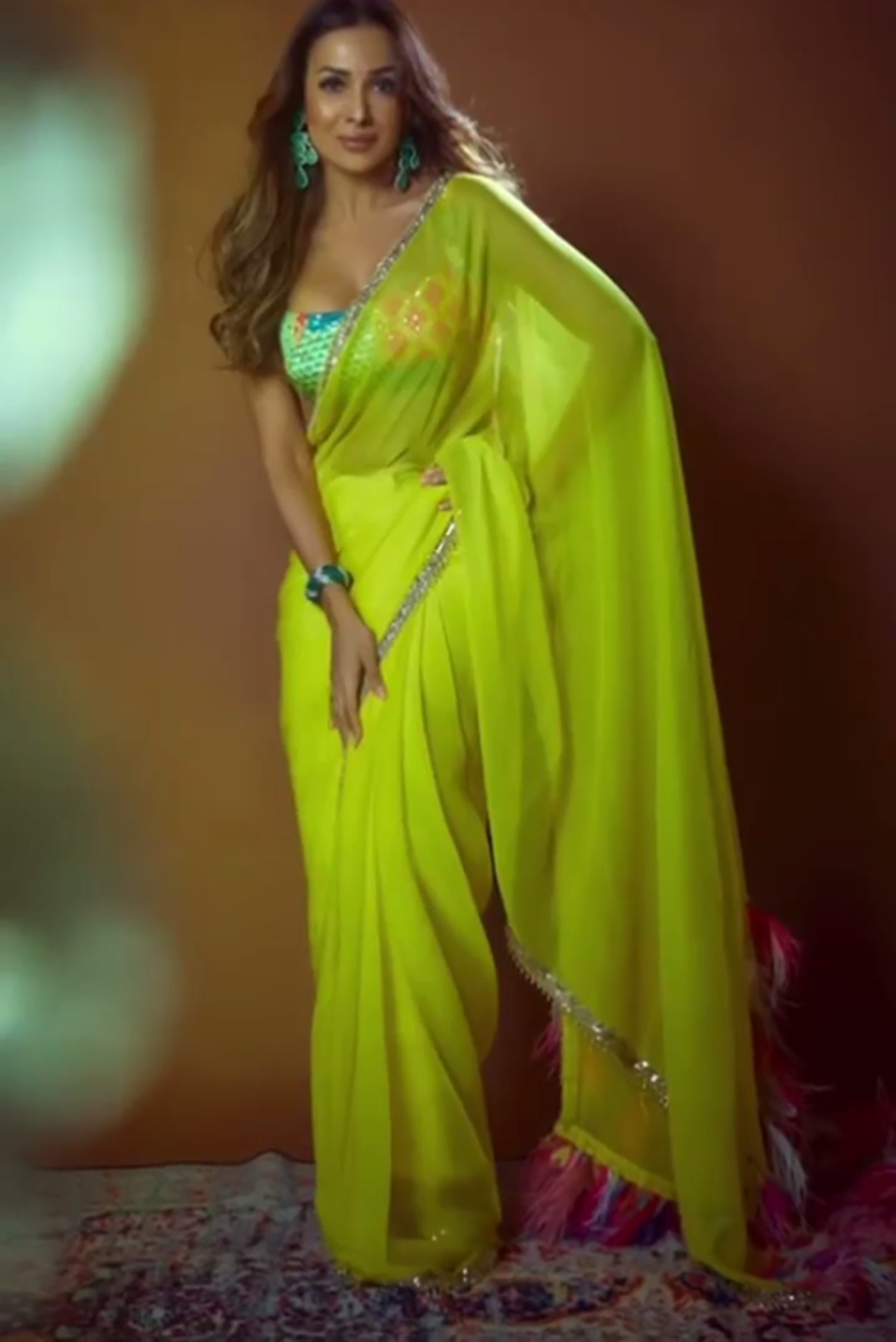 Malaika Arora looks extremely sexy in a lemon yellow saree and printed blouse