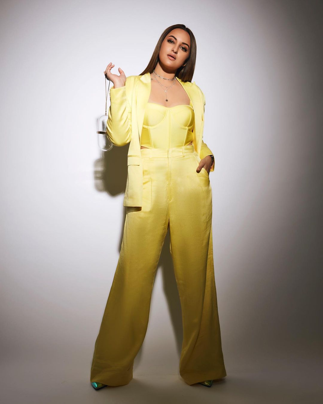 Sonakshi Sinha looked uber chic in the yellow satin pantsuit over the matching corset top