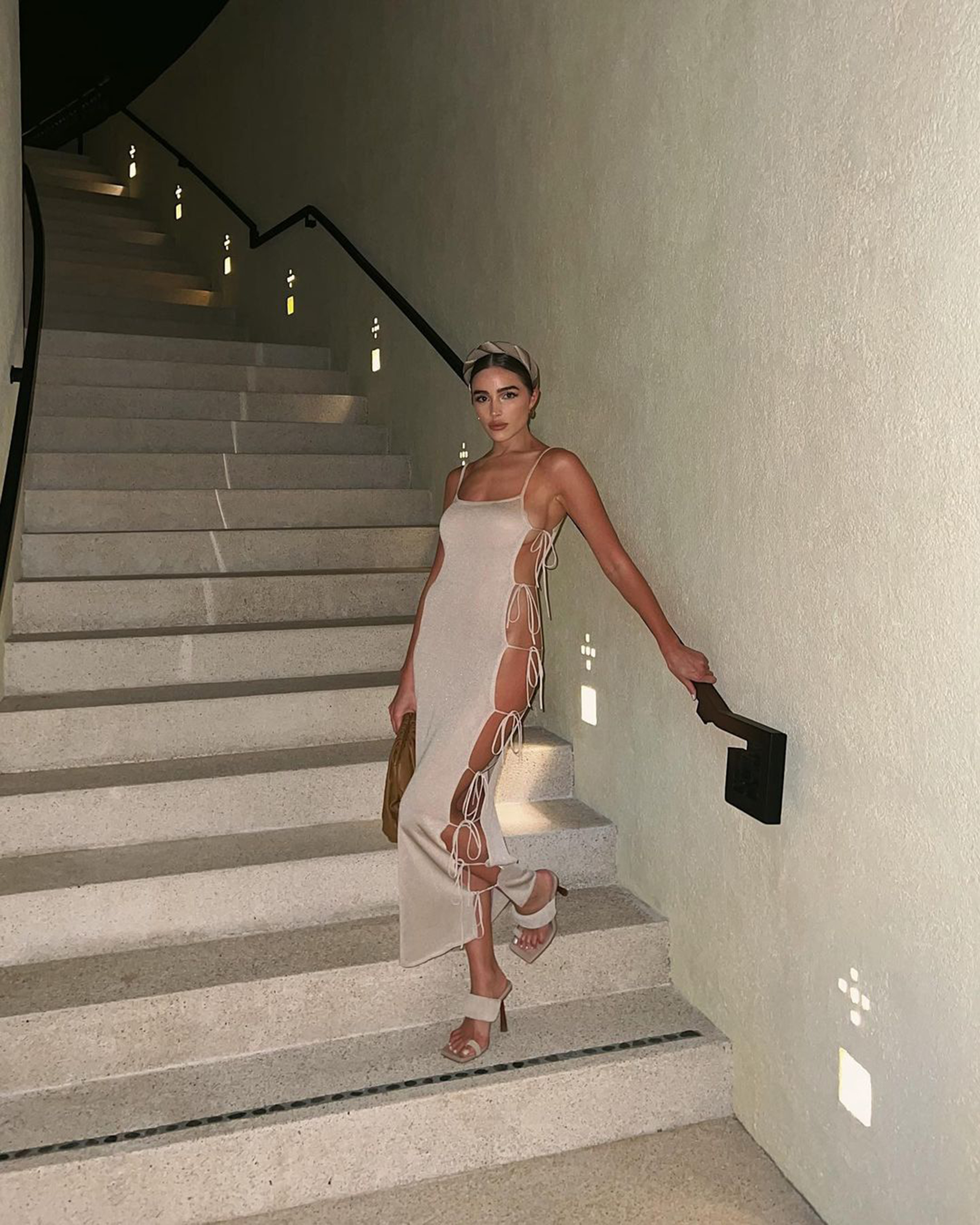 Olivia Culpo shades American Airlines in sexy open-sided dress