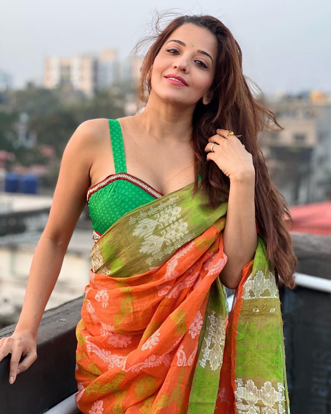 Monalisa looks stunning in the orange saree and sultry blouse