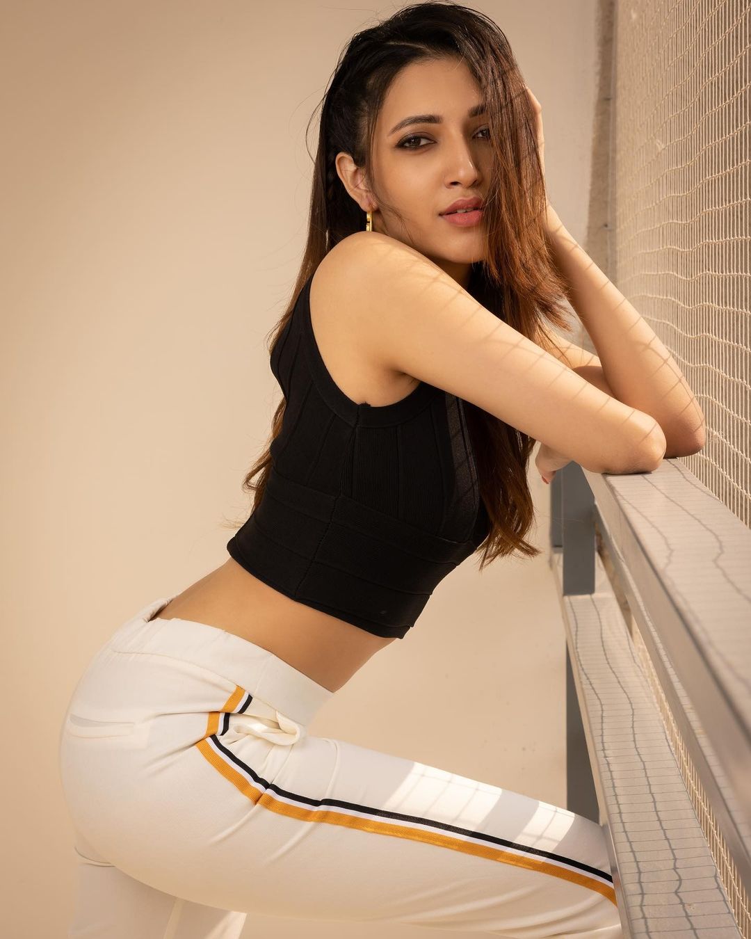 Neha Shetty flaunts her svelte figure in the crop top and joggers