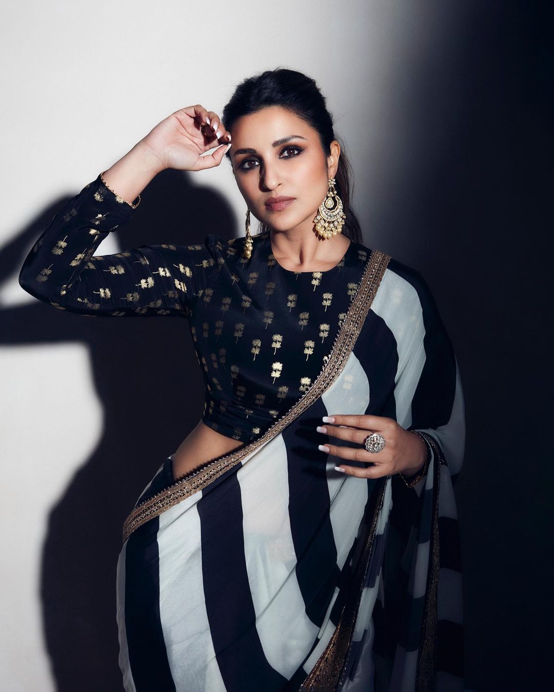 Parineeti Chopra looks classy in a striped saree with a full-sleeve blouse