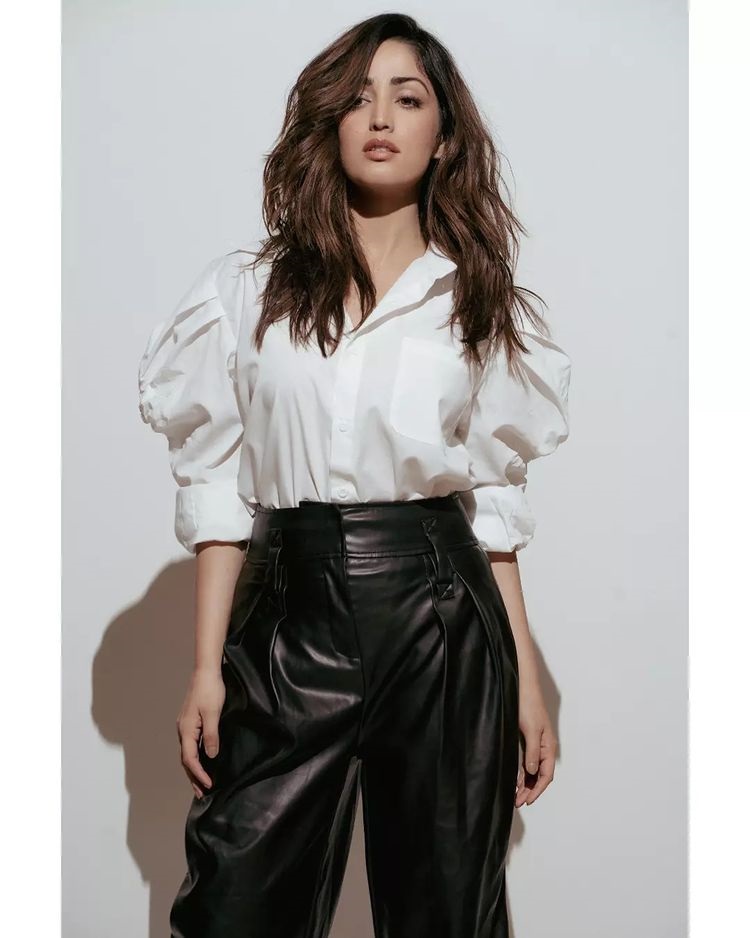 Yami Gautam pairs the black faux leather pants with a crisp white shirt
