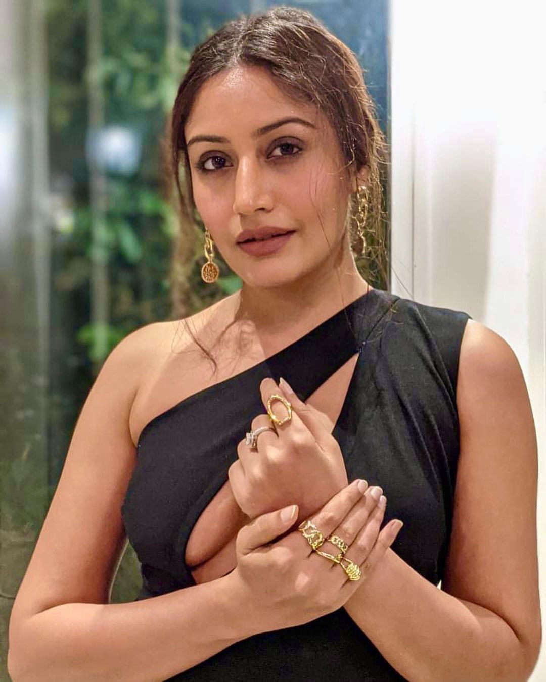 Surbhi Chandna accessorises her look with golden jewellery