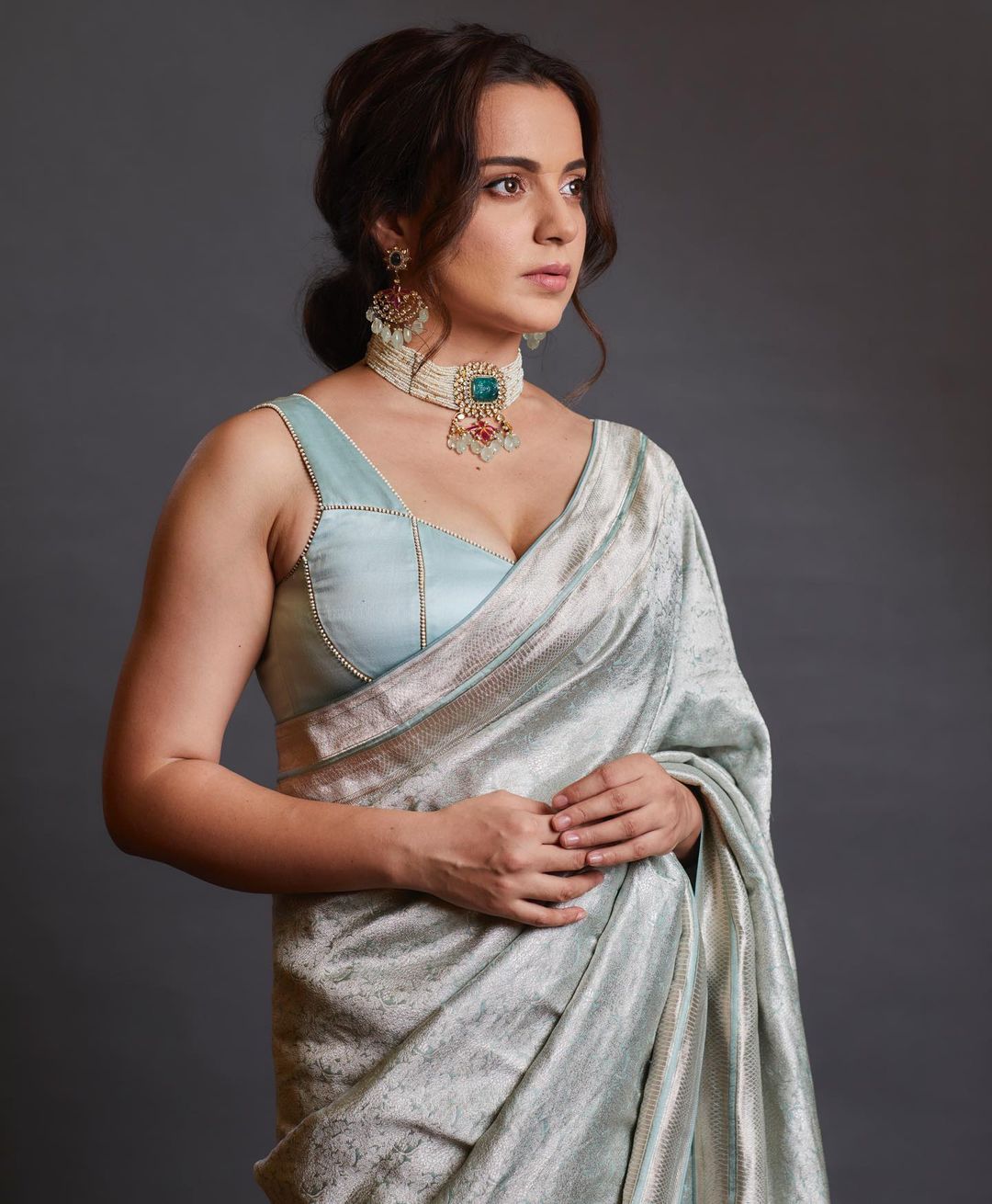 Kangana Ranaut looks regal in the pastel blue saree with the pearl choker