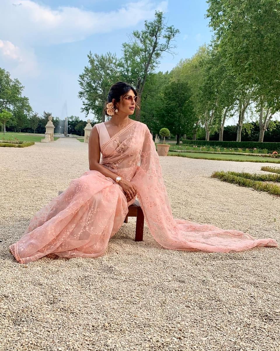 Priyanka Chopra is a picture of elegance in the pastel pink saree