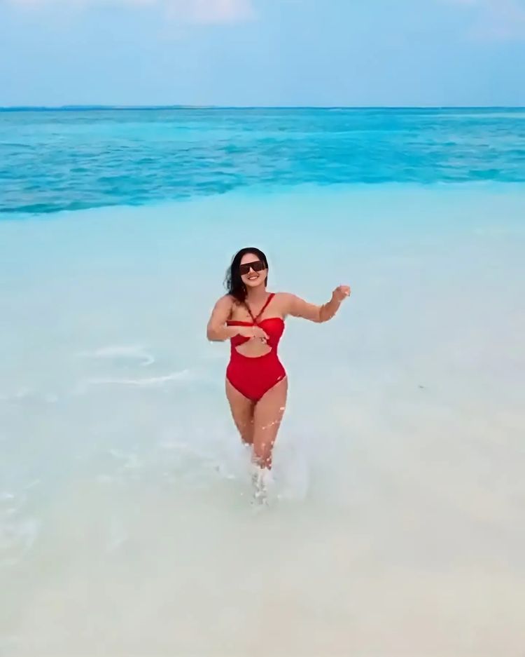 Sunny Leone is giving Baywatch vibes in a red cutout swimsuit in her latest post from Maldives