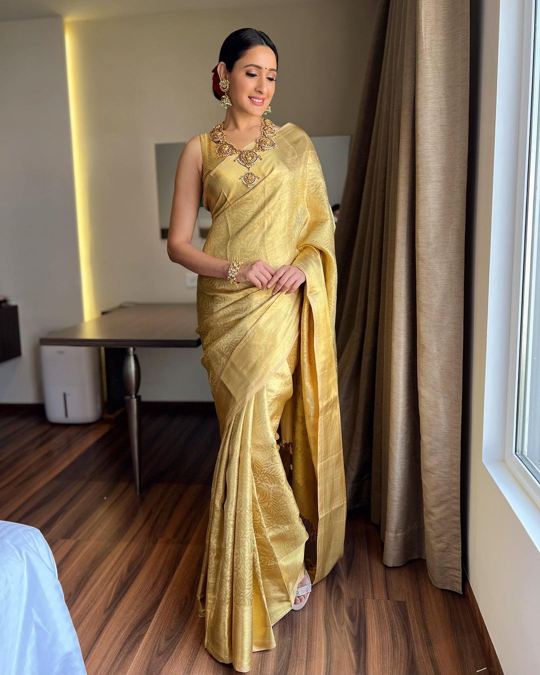 Pragya Jaiswal looks flawless in the golden silk saree