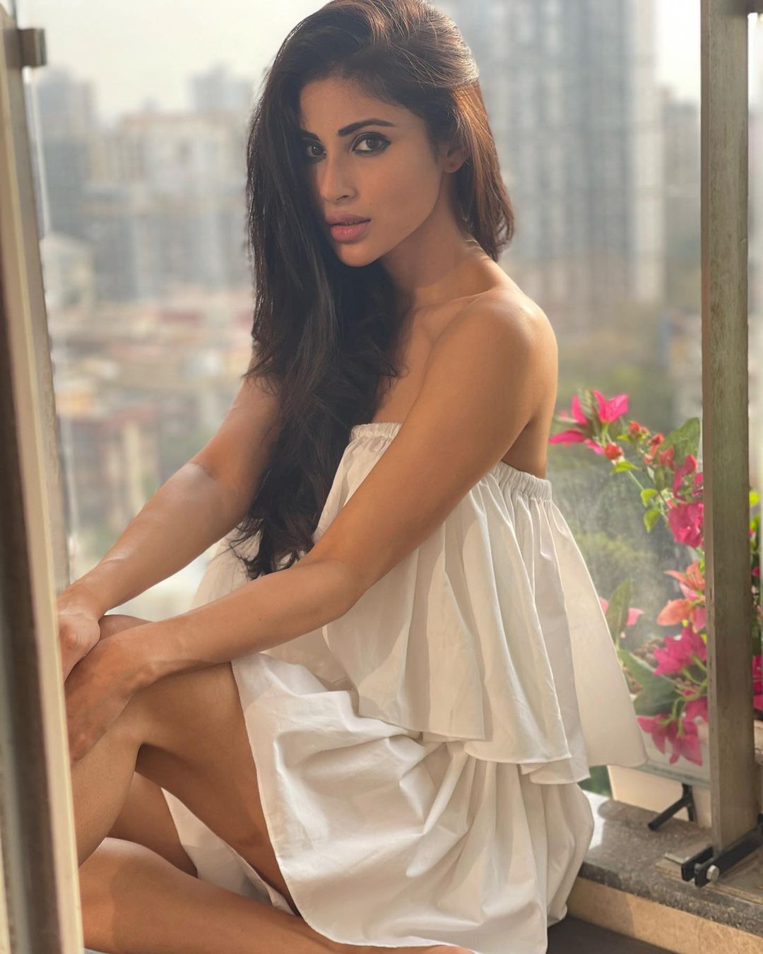 Mouni Roy is giving summer fashion goals in a plain white tiered dress