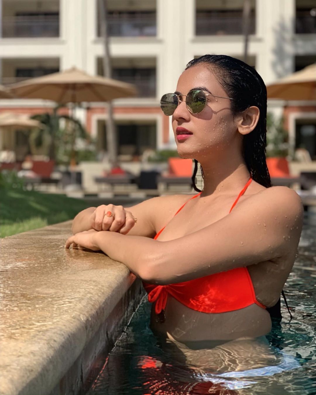 Sonal Chauhan soaks up the sun in a bright orange bikini