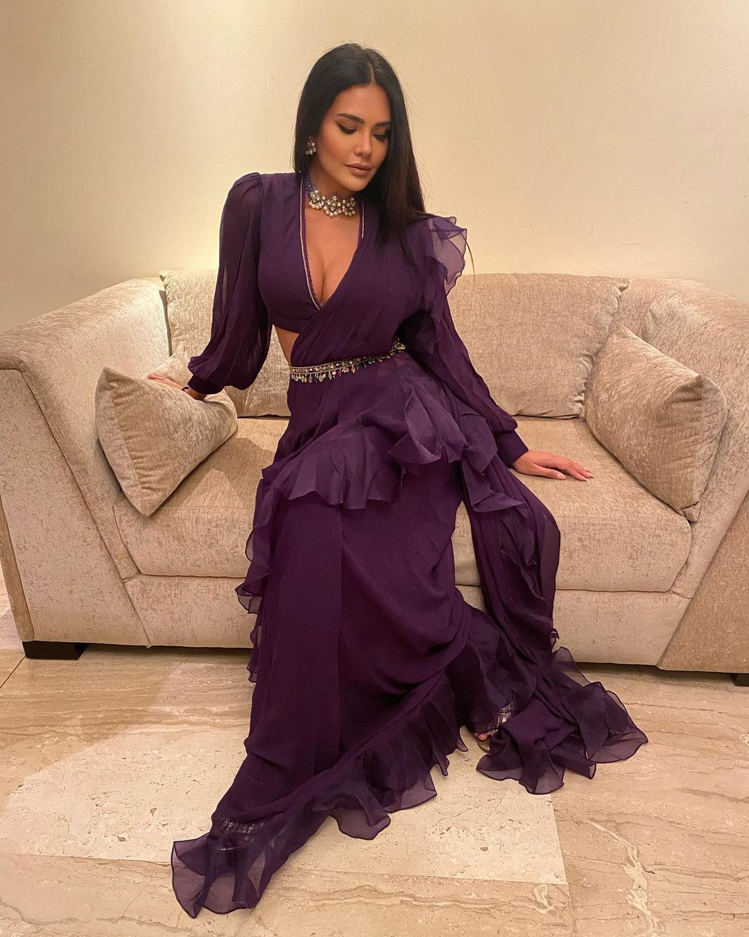 Esha Gupta flaunts her curves in the purple ruffled saree