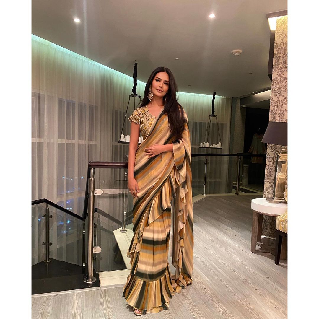 Esha Gupta looks graceful in the striped frilly saree