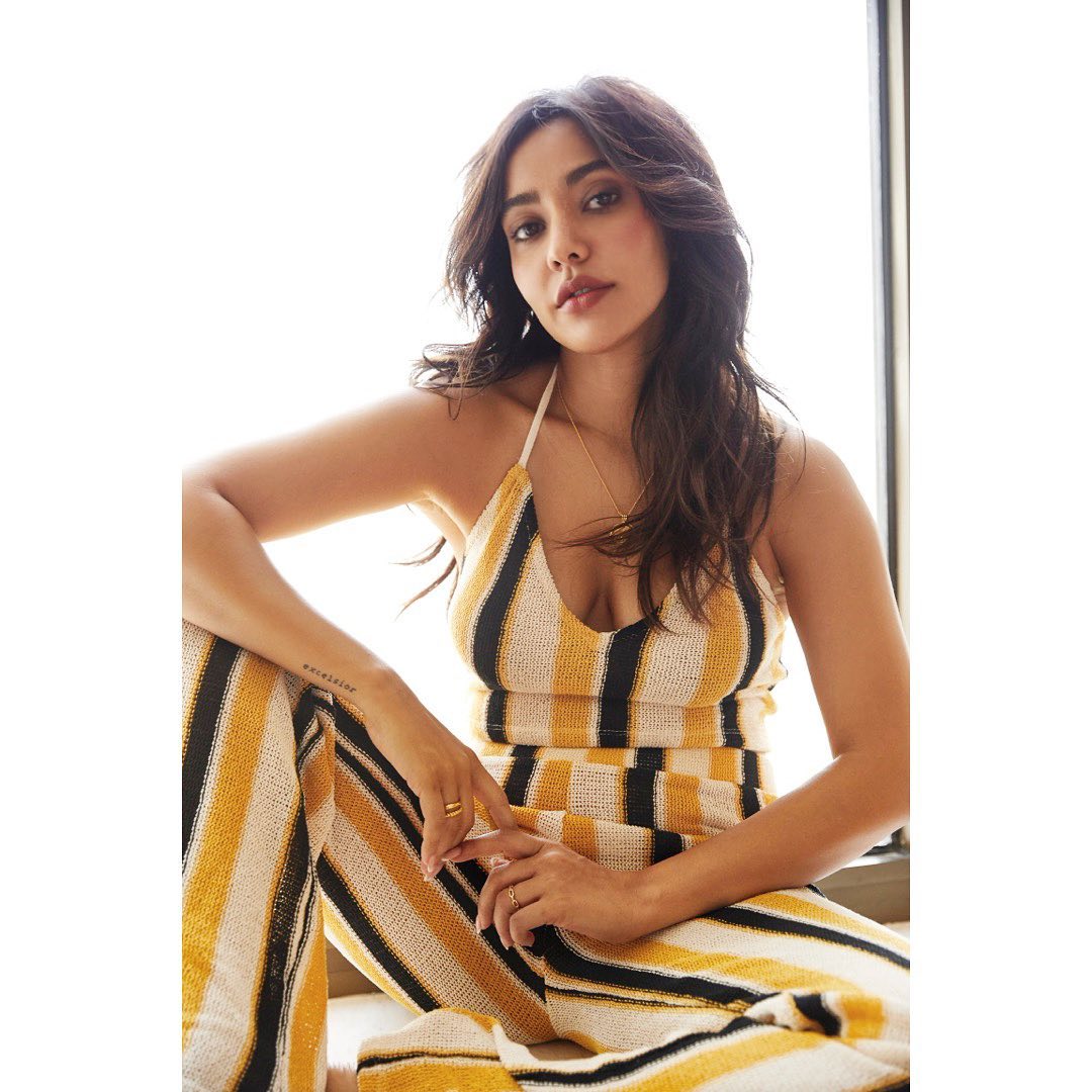 Neha Sharma looks chic in the vertical-striped jumpsuit.