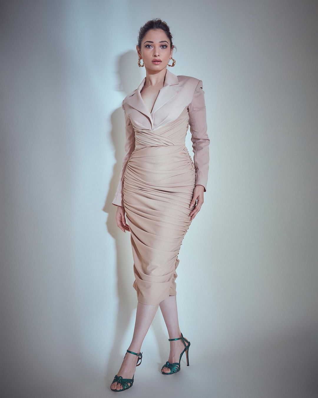 Tamannaah Bhatia looks elegant in the nude blazer-style top and ruched skirt